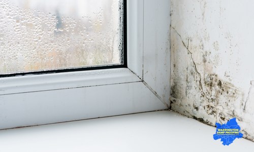 Condensation and black mould on a window reveal